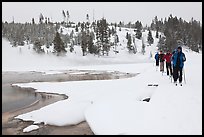 Cross country skiers pass Chromatic Spring. Yellowstone National Park ( color)