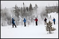 Skiers and thermal steam. Yellowstone National Park, Wyoming, USA.