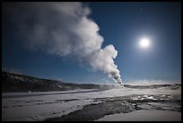 Old Faithful Geyser eruption and moon. Yellowstone National Park, Wyoming, USA.