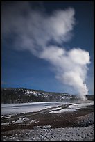 Plume, Old Faithful geyser, winter night. Yellowstone National Park, Wyoming, USA.