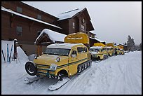 Snow busses in front of Old Faithful Snow Lodge. Yellowstone National Park, Wyoming, USA.