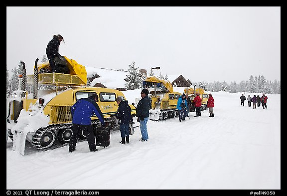 Bombardier snow busses being unloaded at Flagg Ranch. Yellowstone National Park, Wyoming, USA.