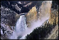 Mist raising from falls of the Yellowstone river. Yellowstone National Park, Wyoming, USA.