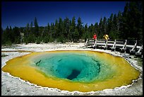 Morning Glory Pool with hikers. Yellowstone National Park, Wyoming, USA.