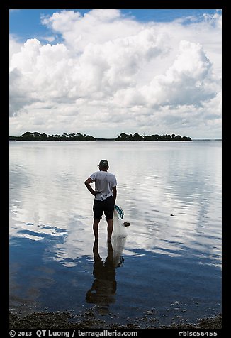 Fisherman holding net. Biscayne National Park, Florida, USA.