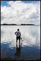 Fisherman holding net. Biscayne National Park, Florida, USA. (color)