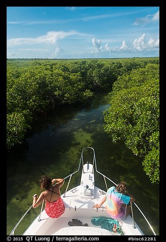 Passengers on front of boat navigating narrow channel. Biscayne National Park (color)