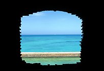 Turquoise waters framed by a cannon embrasure in Fort Jefferson. Dry Tortugas National Park, Florida, USA.