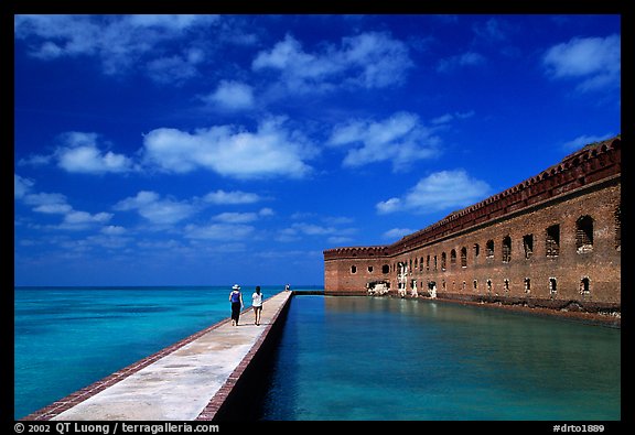 Tourists stroll on the seawall. Dry Tortugas National Park, Florida, USA.