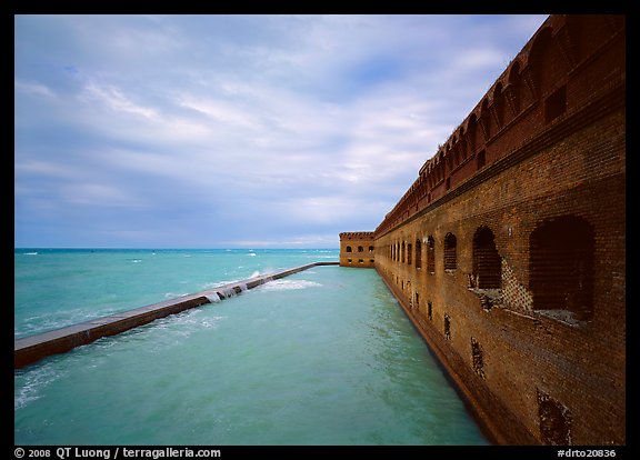 Fort Jefferson massive brick wall overlooking the ocean, cloudy weather. Dry Tortugas National Park, Florida, USA.