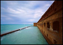 Fort Jefferson massive brick wall overlooking the ocean, cloudy weather. Dry Tortugas National Park ( color)