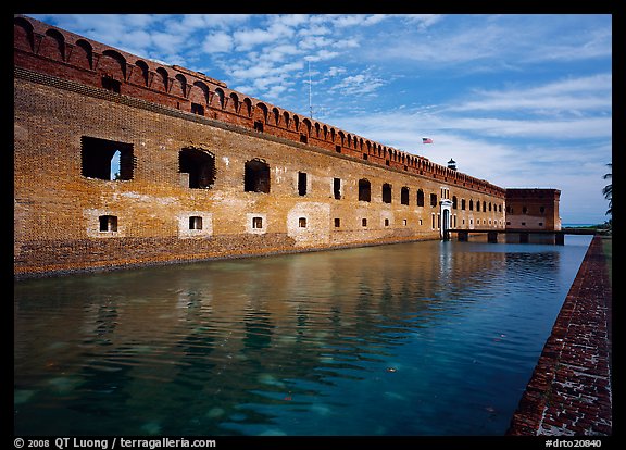 Fort Jefferson moat, walls and lighthouse. Dry Tortugas National Park, Florida, USA.