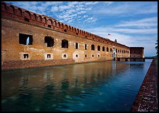 Fort Jefferson moat, walls and lighthouse. Dry Tortugas National Park, Florida, USA.