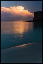 Beach, cloud and fort at sunrise. Dry Tortugas National Park, Florida, USA. (color)