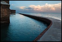 Seawall at sunrise. Dry Tortugas National Park, Florida, USA. (color)