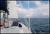 Loggerhead lighthouse seen from sailboat under blue skies. Dry Tortugas National Park, Florida, USA. (color)