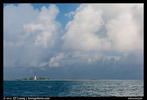 Loggerhead key and lighthouse under tropical clouds. Dry Tortugas National Park, Florida, USA.