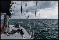 Loggerhead lighthouse seen from sailboat under dark skies. Dry Tortugas National Park ( color)