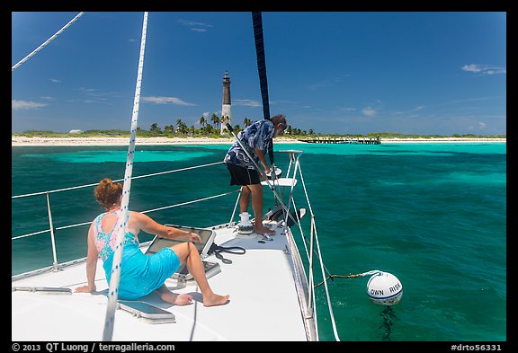 Sailors hooking mooring buoy at Loggerhead Key. Dry Tortugas National Park (color)