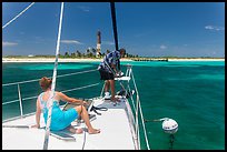 Sailors hooking mooring buoy at Loggerhead Key. Dry Tortugas National Park, Florida, USA. (color)