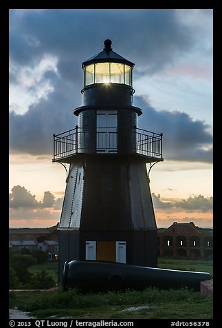 Harbor Light and gun at sunset. Dry Tortugas National Park, Florida, USA.