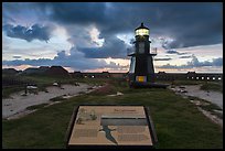 Interpretive sign, Harbor Light, and fort Jefferson. Dry Tortugas National Park, Florida, USA. (color)