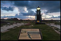 Interpretive sign, Harbor Light, and fort Jefferson. Dry Tortugas National Park, Florida, USA.