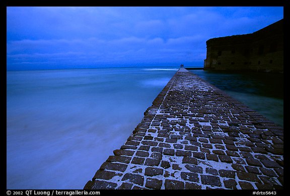 Brick seawall at dusk during a storm. Dry Tortugas National Park, Florida, USA.