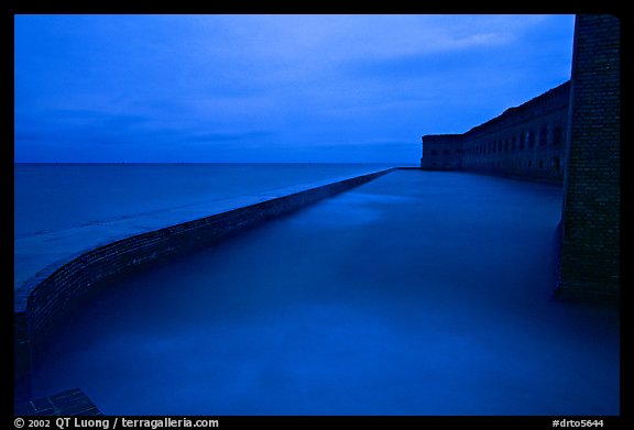 Seawall at dusk during  storm. Dry Tortugas National Park, Florida, USA.