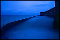 Seawall at dusk during  storm. Dry Tortugas National Park, Florida, USA.