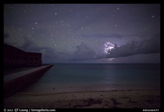 Fort Jefferson and beach at night with cloud electric storm. Dry Tortugas National Park, Florida, USA.