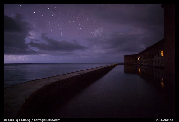 Fort Jefferson at night with stars and light from storm. Dry Tortugas National Park, Florida, USA.