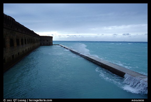 Seawall and moat with waves on stormy day. Dry Tortugas National Park, Florida, USA.