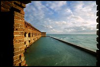 Fort Jefferson wall and moat, framed by cannon window. Dry Tortugas National Park, Florida, USA. (color)