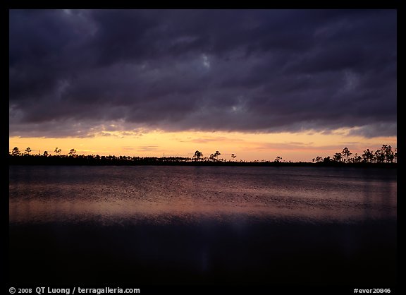 Sunset with dark clouds,  Pine Glades Lake. Everglades National Park, Florida, USA.