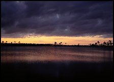 Sunset with dark clouds,  Pine Glades Lake. Everglades National Park, Florida, USA. (color)