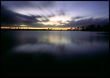 Dusk at Pine Glades Lake, with blured water and clouds. Everglades National Park, Florida, USA. (color)