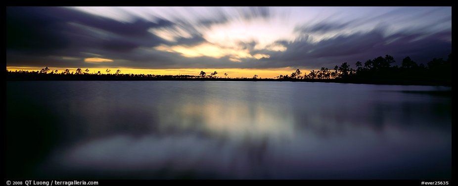 Dark clouds in motion at sunset over lake. Everglades National Park (color)