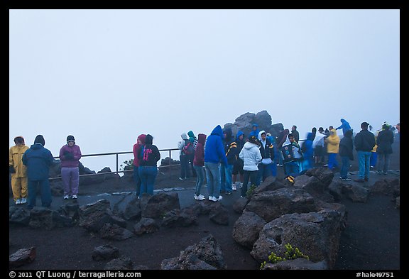Tourists waiting for sunrise. Haleakala National Park, Hawaii, USA.