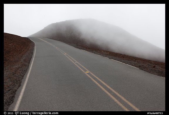 Summit road in fog, Haleakala crater. Haleakala National Park, Hawaii, USA.