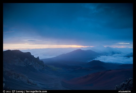 Haleakala crater and rain clouds at sunrise. Haleakala National Park, Hawaii, USA.