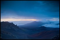 Haleakala crater and rain clouds at sunrise. Haleakala National Park, Hawaii, USA.