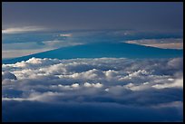 Mauna Kea between clouds, seen from Halekala summit. Haleakala National Park, Hawaii, USA.