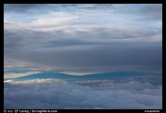 Mauna Kea and Mauna Loa between clouds. Haleakala National Park, Hawaii, USA.