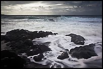 Waves breaking on volcanic rocks. Haleakala National Park, Hawaii, USA.