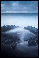 Surf, rocks, ocean and clouds, long exposure. Haleakala National Park, Hawaii, USA.