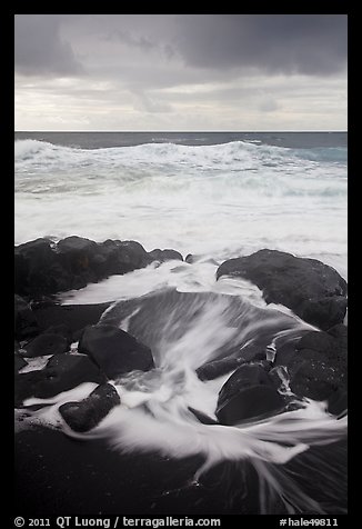 Surf, rocks, ocean and clouds. Haleakala National Park, Hawaii, USA.