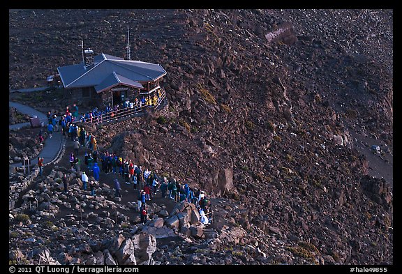 Visitor center and sunrise watchers at dawn. Haleakala National Park, Hawaii, USA.