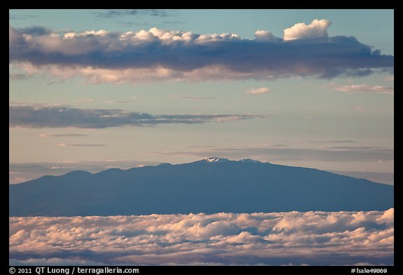 Mauna Kea and clouds at sunrise. Haleakala National Park, Hawaii, USA.