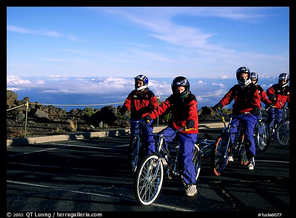 Getting ready to ride bicycles down from the top of the Crater to sea level. Haleakala National Park, Hawaii, USA.